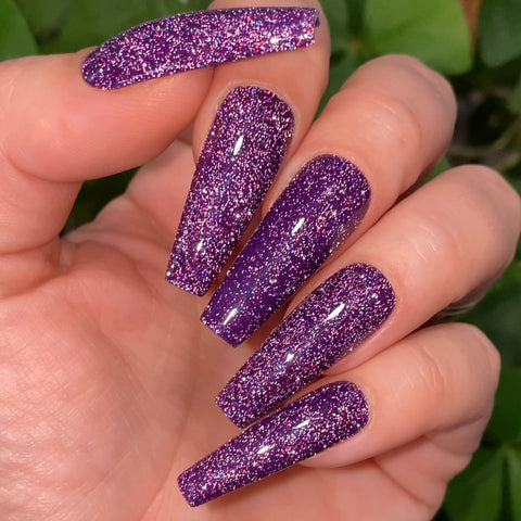 Purple reflective glitter fake nails.